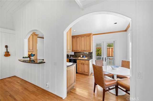 430 Anita St, Laguna Beach, CA 92651 - kitchen featuring arched walkways, light wood finished floors, backsplash, ornamental molding, and dishwasher