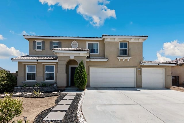 14075 Tourmaline St, Hesperia, CA 92344 - mediterranean / spanish house with stucco siding, concrete driveway, a tile roof, and a garage