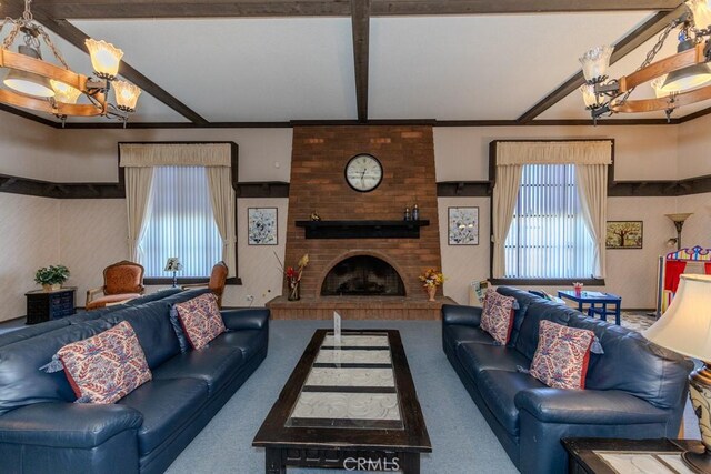 2851 Rolling Hills Dr Unit 255, Fullerton, CA 92835 - carpeted living room with a chandelier, beamed ceiling, and a brick fireplace