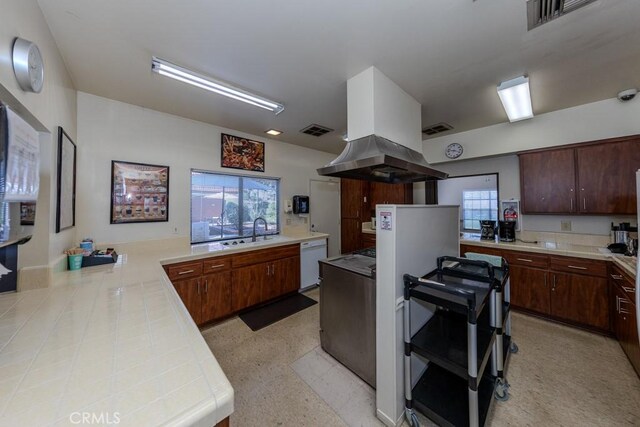 2851 Rolling Hills Dr Unit 255, Fullerton, CA 92835 - kitchen featuring white dishwasher, island range hood, and a peninsula