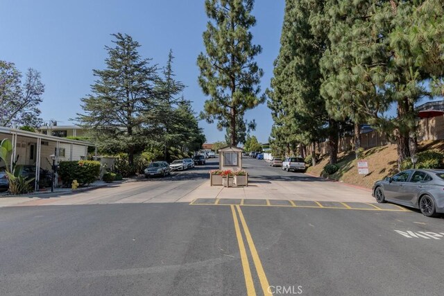 2851 Rolling Hills Dr Unit 255, Fullerton, CA 92835 - view of asphalt street featuring curbs