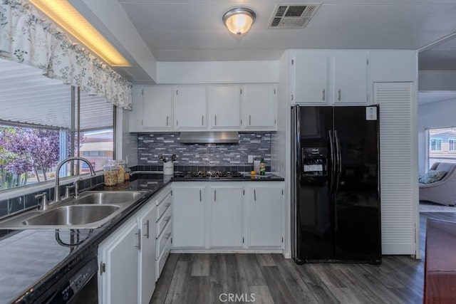 2851 Rolling Hills Dr Unit 255, Fullerton, CA 92835 - kitchen with black appliances, wood finished floors, white cabinetry, and dark countertops