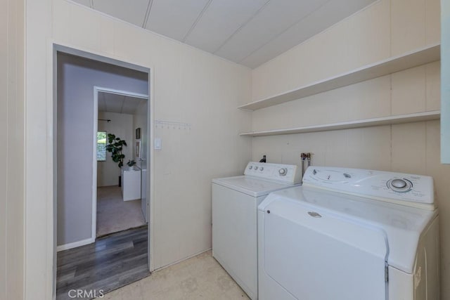 2851 Rolling Hills Dr Unit 255, Fullerton, CA 92835 - laundry area with washing machine and clothes dryer and light wood-style flooring