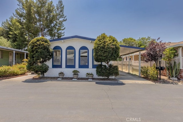 2851 Rolling Hills Dr Unit 255, Fullerton, CA 92835 - view of front facade with a carport and stucco siding
