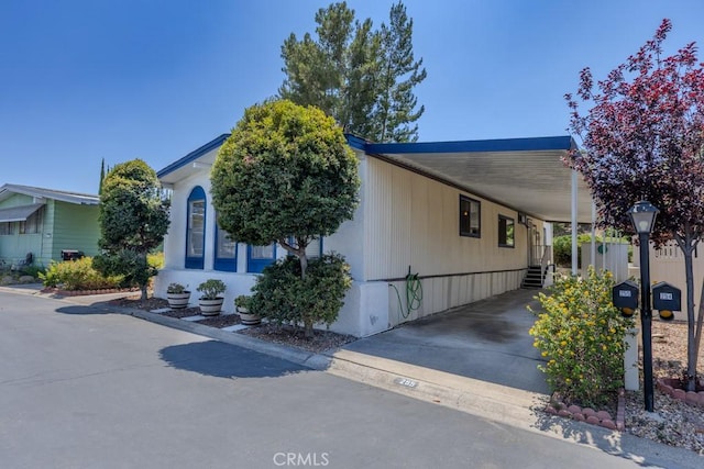 2851 Rolling Hills Dr Unit 255, Fullerton, CA 92835 - view of front of house with a carport and driveway