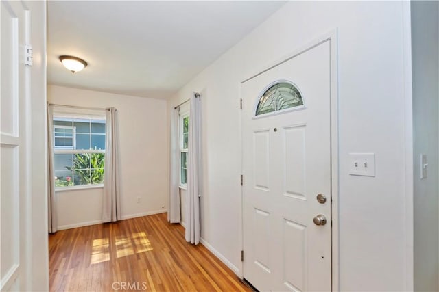 617 N Palm Ave, Upland, CA 91786 - foyer with light wood-style flooring and baseboards