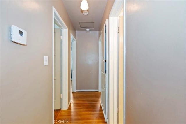 617 N Palm Ave, Upland, CA 91786 - corridor with light wood finished floors and attic access