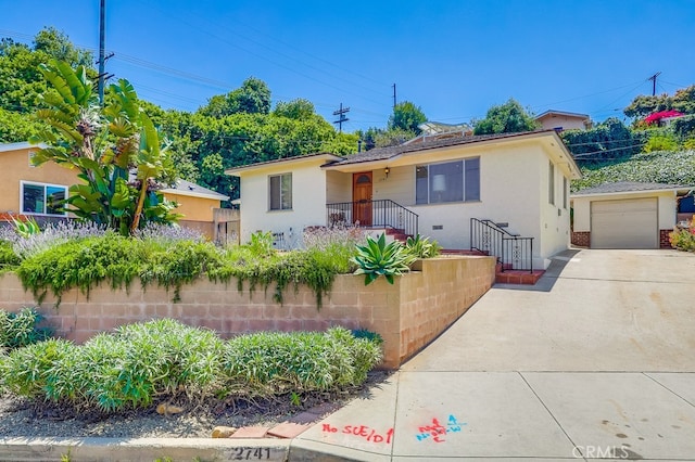 2741 S Walker Ave, San Pedro, CA 90731 - view of front of property with concrete driveway, stucco siding, and an outdoor structure