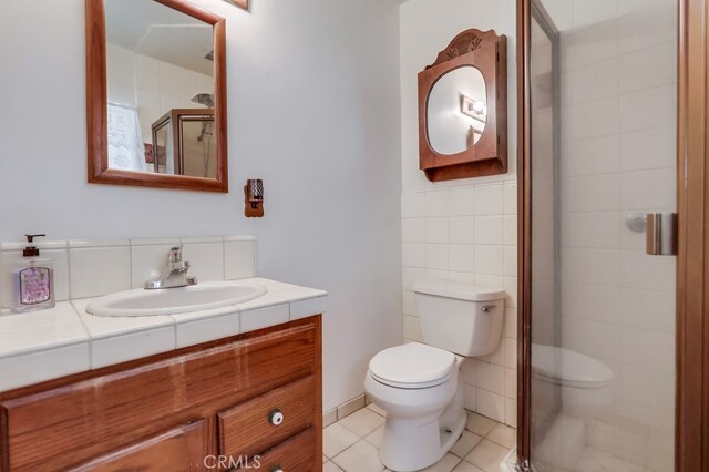 2741 S Walker Ave, San Pedro, CA 90731 - full bathroom with vanity, a stall shower, tile patterned flooring, and tile walls