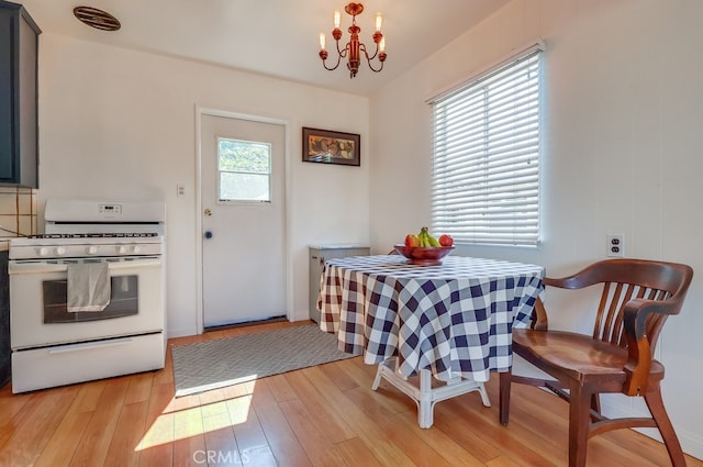 2741 S Walker Ave, San Pedro, CA 90731 - dining room with light wood-type flooring and a chandelier