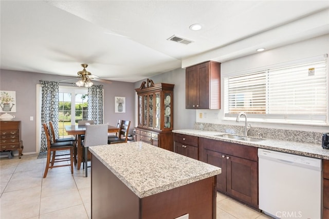 31652 Loma Linda Rd, Temecula, CA 92592 - kitchen with dishwasher, ceiling fan, light tile patterned floors, a center island, and recessed lighting