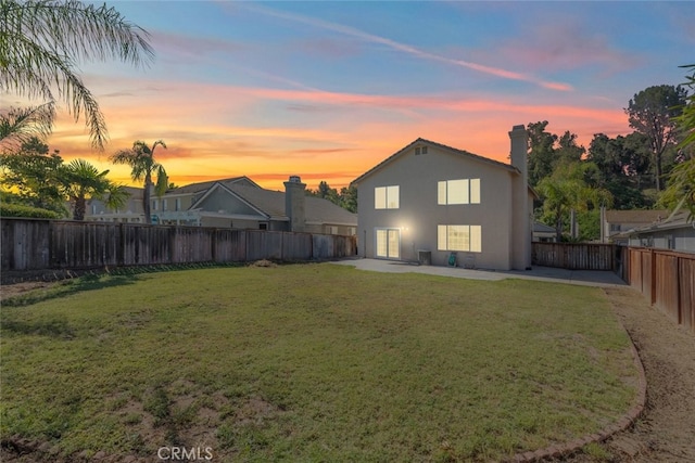 31652 Loma Linda Rd, Temecula, CA 92592 - back of house at dusk featuring a patio area, a fenced backyard, and stucco siding