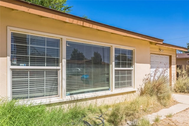 15917 Lee St, Mojave, CA 93501 - view of home's exterior featuring stucco siding and a garage