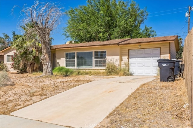 15917 Lee St, Mojave, CA 93501 - single story home with a garage, driveway, and stucco siding