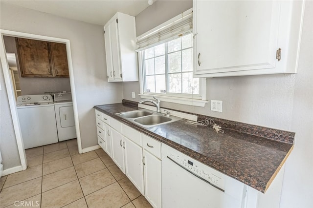 15917 Lee St, Mojave, CA 93501 - kitchen with independent washer and dryer, dark countertops, white cabinetry, and light tile patterned floors