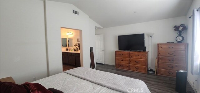 315 Fuente Dr, Guadalupe, CA 93434 - bedroom with dark wood-style floors, lofted ceiling, and ensuite bathroom