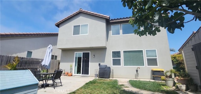 315 Fuente Dr, Guadalupe, CA 93434 - back of house with stucco siding, a patio area, and a tile roof