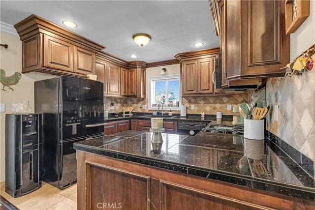 4477 Los Serranos Blvd, Chino Hills, CA 91709 - kitchen with black appliances, tile counters, crown molding, a peninsula, and decorative backsplash