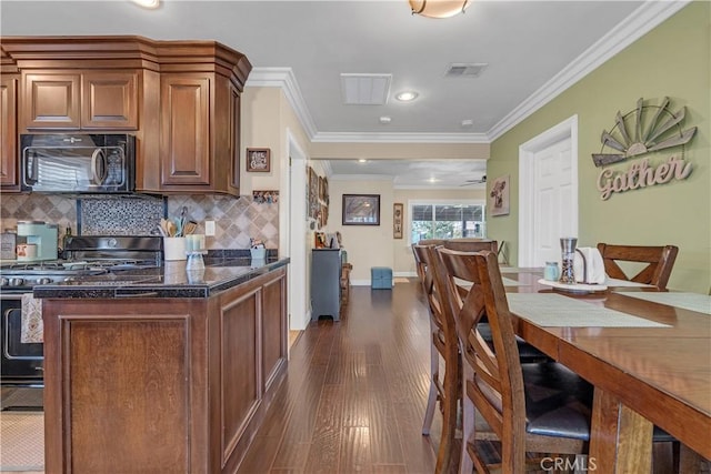 4477 Los Serranos Blvd, Chino Hills, CA 91709 - kitchen featuring black appliances, dark wood-style floors, tasteful backsplash, crown molding, and recessed lighting