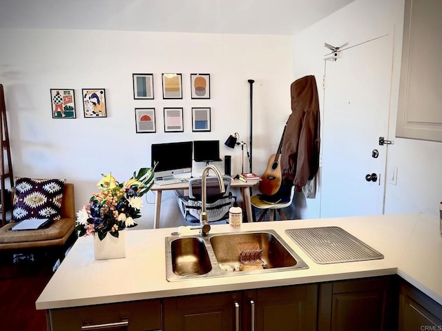 3029 Broadway Unit 22, San Diego, CA 92102 - kitchen featuring light countertops, a desk, and dark brown cabinets