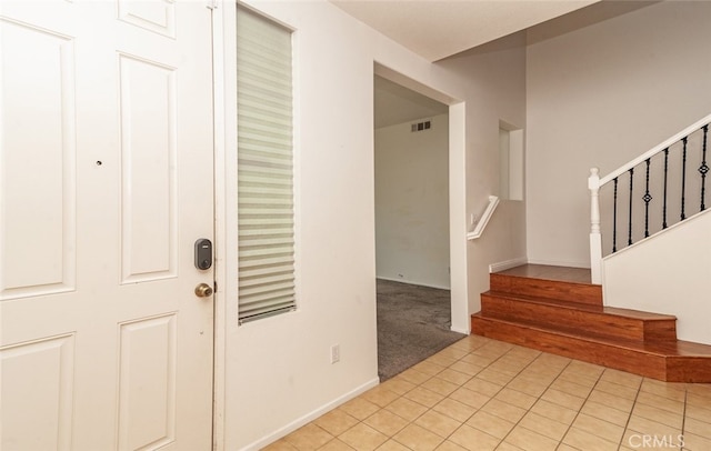 26508 Veramonte Ave, Murrieta, CA 92562 - entrance foyer with light tile patterned floors, stairs, and light colored carpet