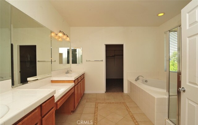 26508 Veramonte Ave, Murrieta, CA 92562 - full bath featuring tile patterned floors, a bath, double vanity, a walk in closet, and recessed lighting