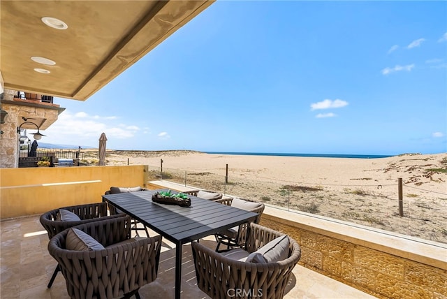 1554 E Oceanfront, Newport Beach, CA 92661 - view of patio / terrace with outdoor dining area and view of water and beach