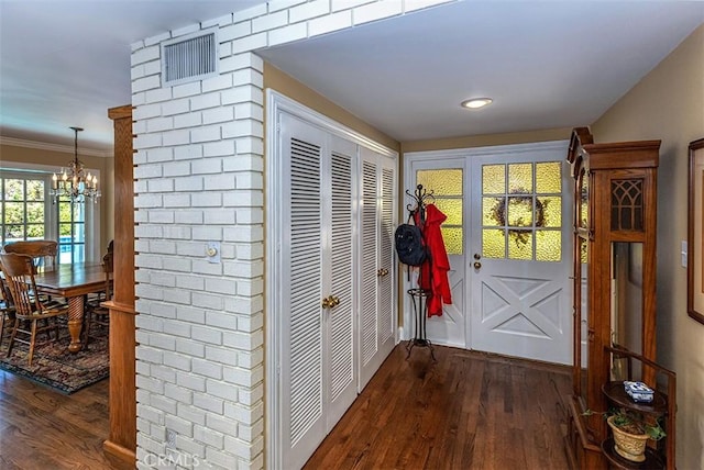 5591 Kenwood Ave, Buena Park, CA 90621 - hallway with a chandelier, dark wood-type flooring, ornamental molding, and recessed lighting