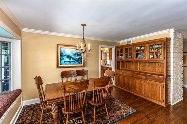 5591 Kenwood Ave, Buena Park, CA 90621 - dining space with a chandelier, dark wood finished floors, and crown molding