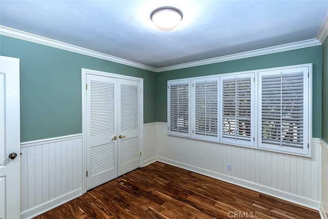 5591 Kenwood Ave, Buena Park, CA 90621 - unfurnished bedroom featuring a closet, wood finished floors, wainscoting, and crown molding