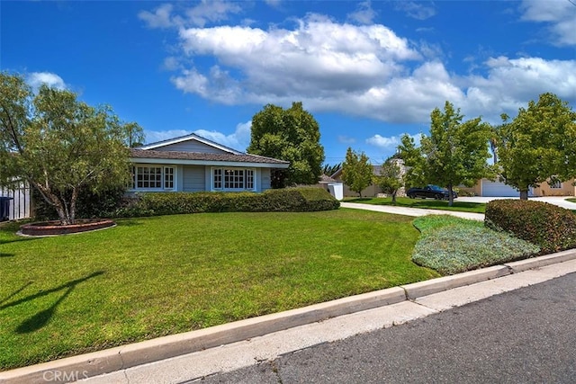5591 Kenwood Ave, Buena Park, CA 90621 - view of front of house featuring a front lawn, driveway, and a garage