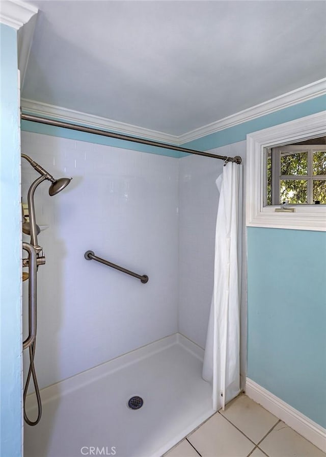 5591 Kenwood Ave, Buena Park, CA 90621 - bathroom with a stall shower, tile patterned floors, and crown molding