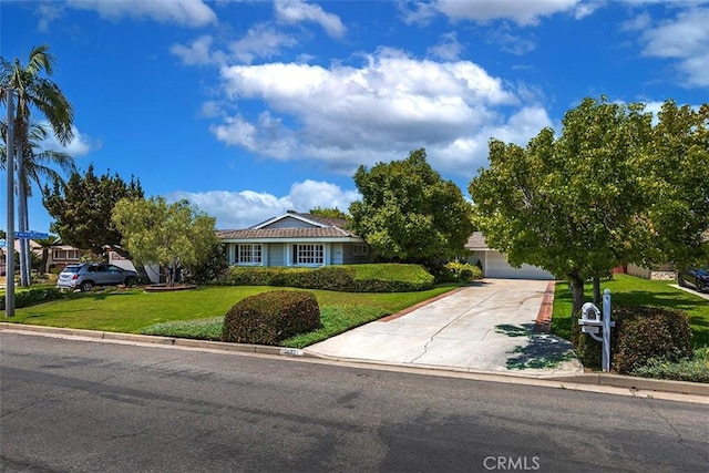 5591 Kenwood Ave, Buena Park, CA 90621 - view of front of home with driveway, a front lawn, and a garage