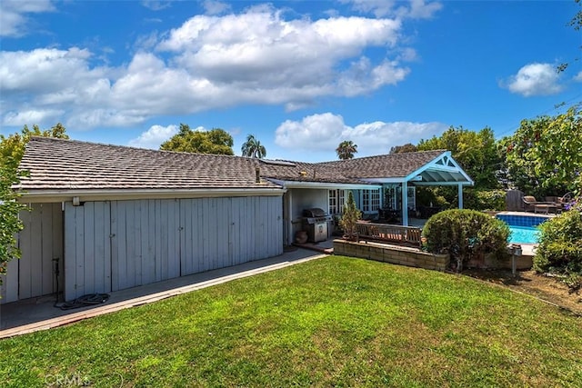 5591 Kenwood Ave, Buena Park, CA 90621 - rear view of house with a yard and an outdoor pool