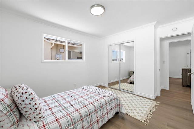 5001 N Darfield Ave, Covina, CA 91724 - bedroom with ornamental molding, wood finished floors, and a closet