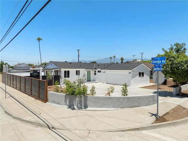 5001 N Darfield Ave, Covina, CA 91724 - view of front of property featuring stucco siding, a garage, and concrete driveway