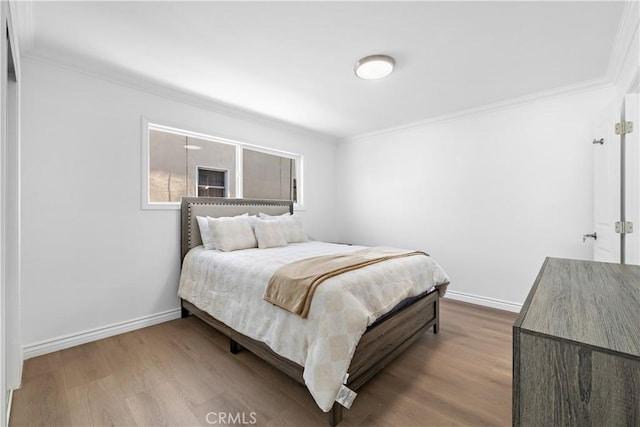 5001 N Darfield Ave, Covina, CA 91724 - bedroom with crown molding and wood finished floors