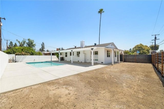 5001 N Darfield Ave, Covina, CA 91724 - rear view of house with a fenced backyard, a patio area, and a chimney