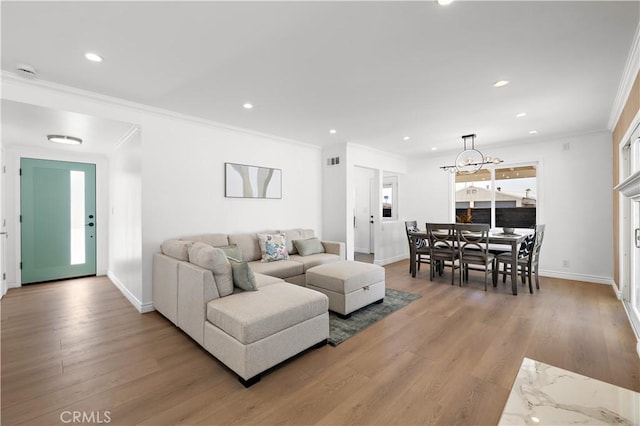 5001 N Darfield Ave, Covina, CA 91724 - living area with a chandelier, light wood-style floors, crown molding, and recessed lighting