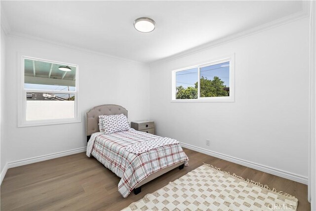 5001 N Darfield Ave, Covina, CA 91724 - bedroom with ornamental molding and wood finished floors
