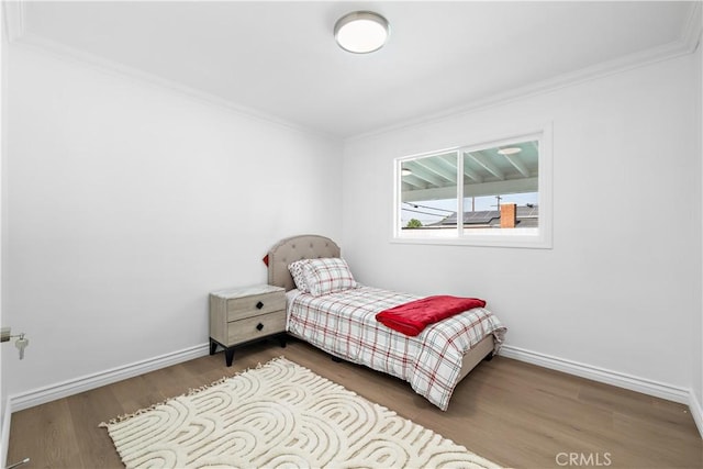 5001 N Darfield Ave, Covina, CA 91724 - bedroom featuring ornamental molding and wood finished floors