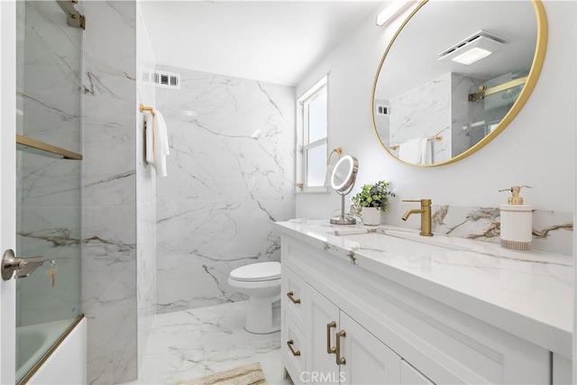 5001 N Darfield Ave, Covina, CA 91724 - bathroom featuring vanity, marble tiled floors, and a combined bath / shower with marble appearance