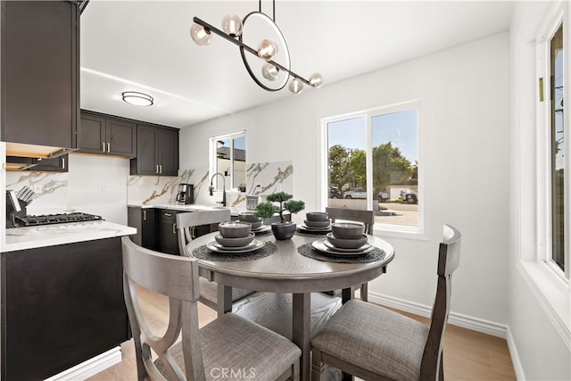 5001 N Darfield Ave, Covina, CA 91724 - dining area featuring a chandelier and light wood-type flooring