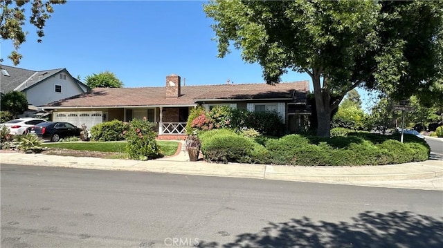 1006 Vanderbilt Ave, Claremont, CA 91711 - single story home with a garage, a chimney, and covered porch