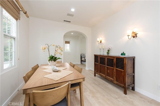 29 Windchime, Irvine, CA 92603 - dining room featuring arched walkways, light wood finished floors, plenty of natural light, and recessed lighting