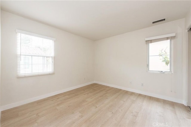 29 Windchime, Irvine, CA 92603 - spare room with plenty of natural light and light wood finished floors