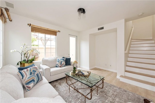 29 Windchime, Irvine, CA 92603 - living room featuring wood finished floors and stairway
