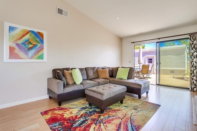 6942 Batiquitos, Carlsbad, CA 92011 - living area with vaulted ceiling and wood finished floors