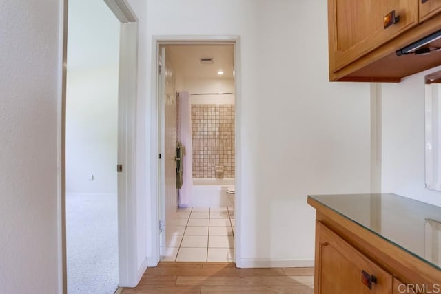 6942 Batiquitos, Carlsbad, CA 92011 - hallway featuring baseboards and light wood-style flooring