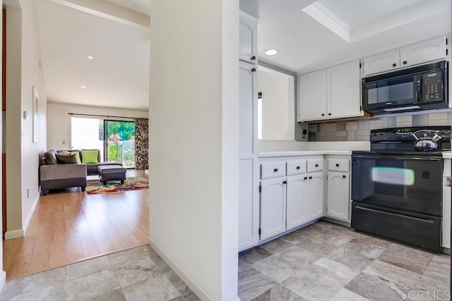 6942 Batiquitos, Carlsbad, CA 92011 - kitchen featuring black appliances, white cabinets, light countertops, tasteful backsplash, and recessed lighting